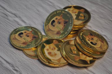 Kuching, Sarawak Malaysia - May 21, 2021: Macro view of gold color shiny coins with Dogecoin symbol clipart