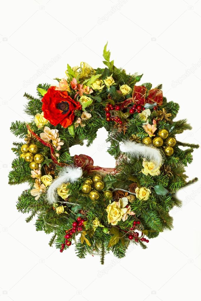 Christmas wreath with flowers and Christmas jewelery, ribbons an