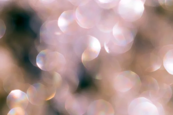 Paillettes d'or en bokeh - fond et ambiance festive — Photo