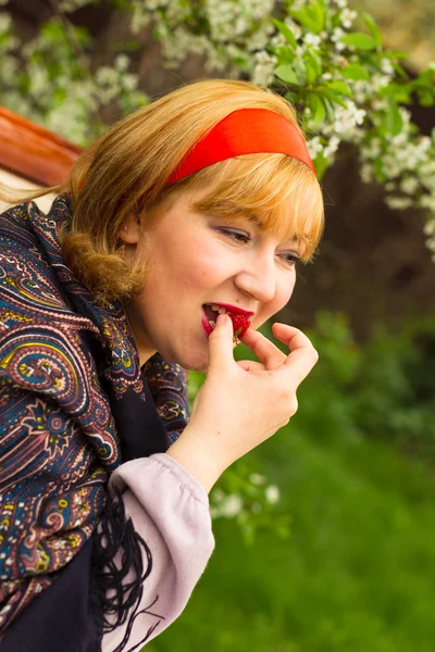 Charming rosy-cheeked young woman dressed in Russian style with — Stock Photo, Image