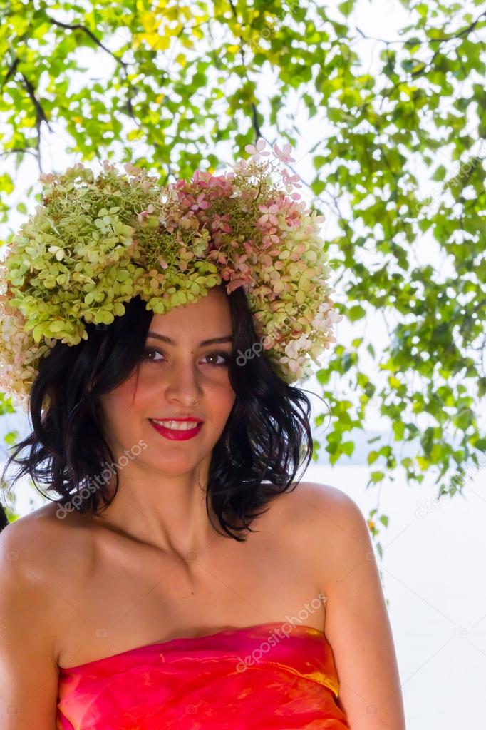 young Russian woman on her head a wreath of flowers hydrangeas, 
