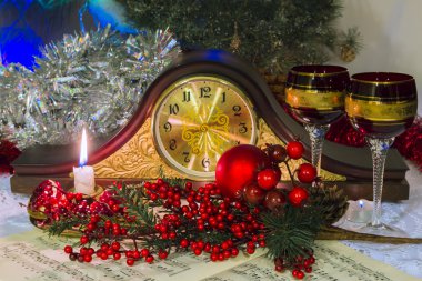 Mantel clocks without hands, surrounded by Christmas accessories clipart