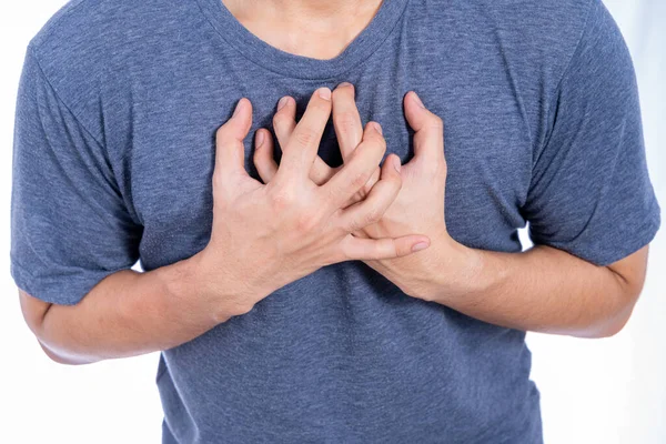 Man Rör Vid Sitt Hjärta Eller Bröstet Isolerad Vit Bakgrund — Stockfoto