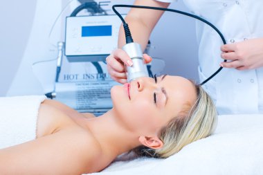 woman getting cryomassage procedure clipart