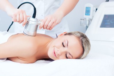 young woman getting cavitation procedure