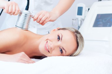 young woman getting cavitation procedure