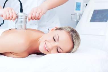 young woman getting cavitation procedure