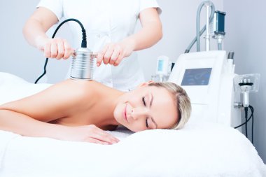 young woman getting cavitation procedure