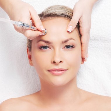 woman getting microdermabrasion procedure
