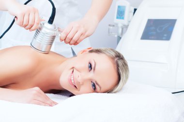 young woman getting cavitation procedure