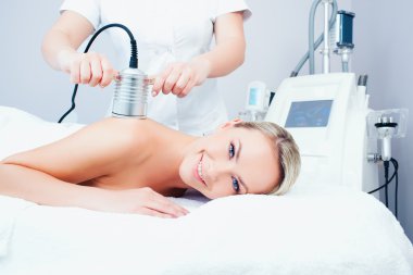 young woman getting cavitation procedure
