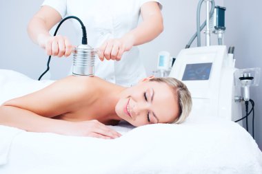 young woman getting cavitation procedure