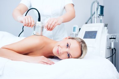 young woman getting cavitation procedure