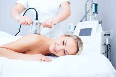 young woman getting cavitation procedure
