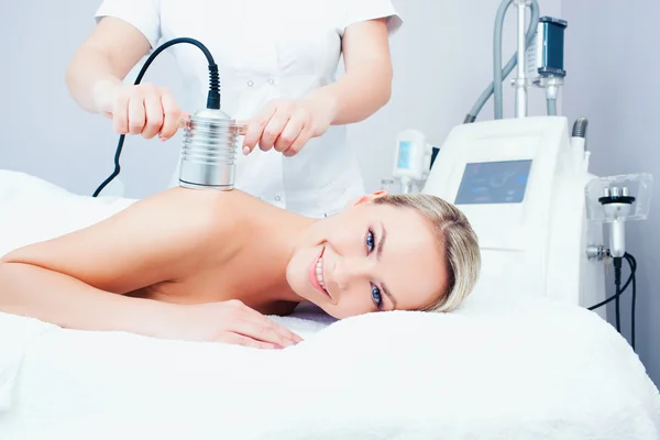 Young woman getting cavitation procedure — Stock Photo, Image