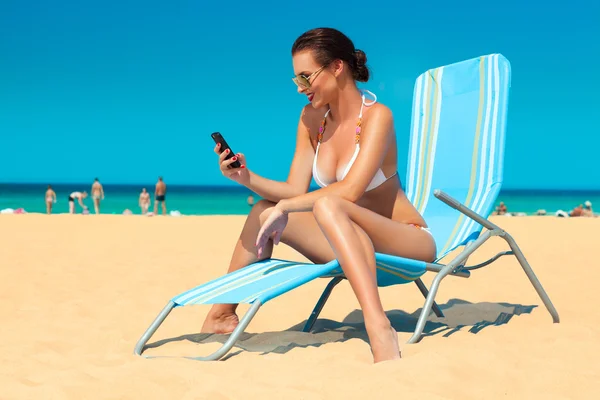 Young woman in white bikini Stock Image