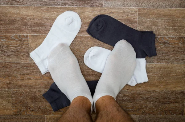 Man Hairy Legs White Sports Socks Stands Socks Scattered Floor Stock Image