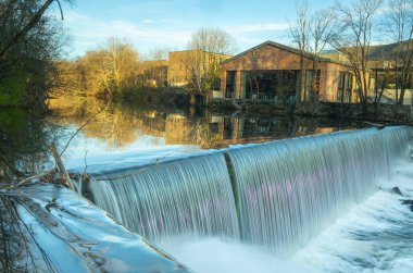 Beacon, NY - USA - Nov. 29, 2020: Landscape view of the iconic Beacon Falls on the Fishkill creek, located off of Main Street in Beacon. clipart