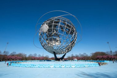 Queens, NY - April 3, 2021: View of the Unisphere, a spherical stainless steel representation of the Earth. Designed by Gilmore D. Clarke for the 1964 New York World's Fair.