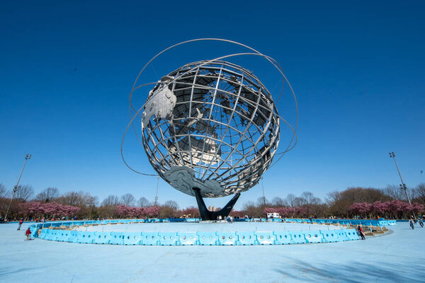 Queens, NY - April 3, 2021: View of the Unisphere, a spherical stainless steel representation of the Earth. Designed by Gilmore D. Clarke for the 1964 New York World's Fair.