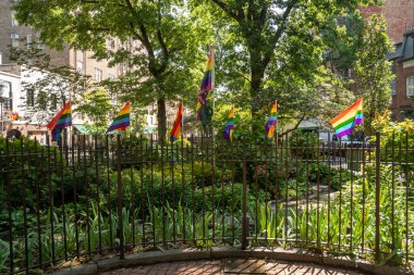 New York, NY - USA - July 30, 2011: A view of Stonewall National Monument, in Christopher Park, part of New York City's Historic Greenwich Village. The site of the Stonewall riots. clipart