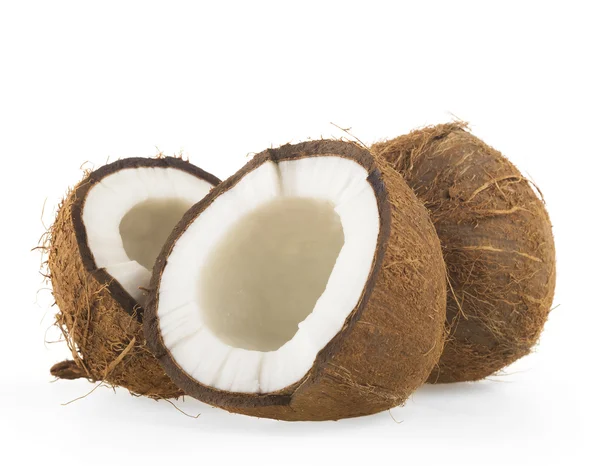 Kokosové ořechy, snížit na polovinu na pozadí — Stock fotografie