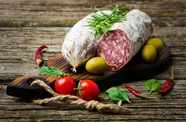 Italian Salami Rosemary Pepper Cherry Tomatoes Olives Wooden Background — Stock Photo, Image