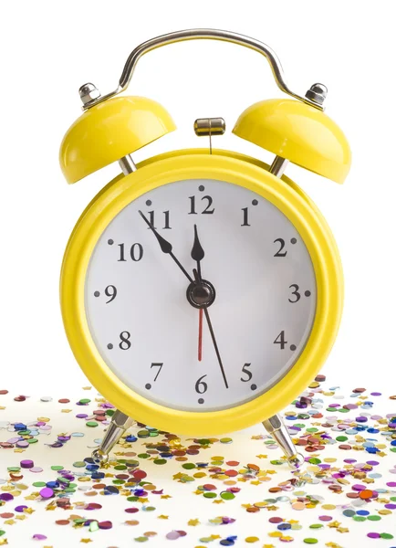 Alarm clock with Christmas confetti — Stock Photo, Image