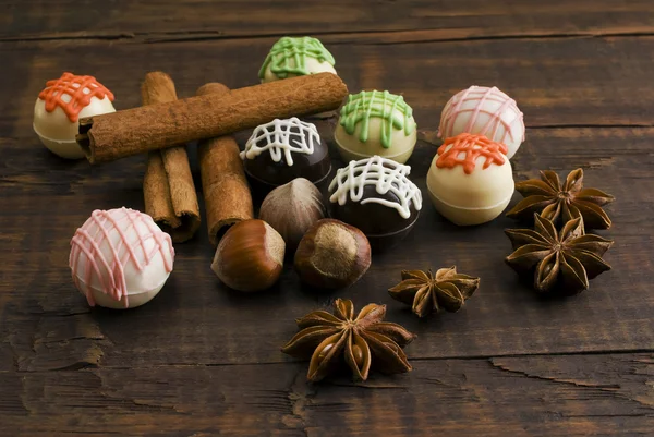 Chocolates and spices — Stock Photo, Image