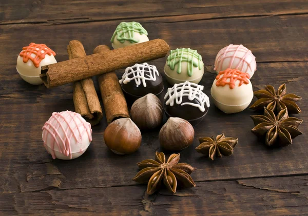 Chocolates and spices — Stock Photo, Image
