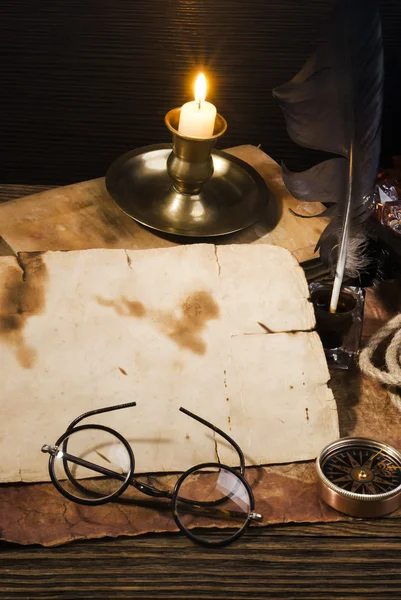 Vintage candle, compass and glasses — Stock Photo, Image