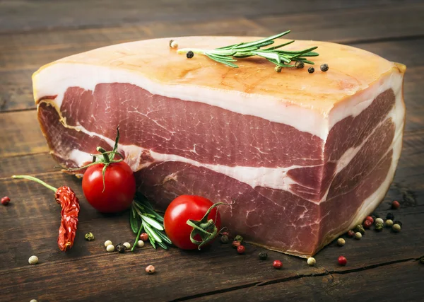 Prosciutto meat with tomatoes — Stock Photo, Image