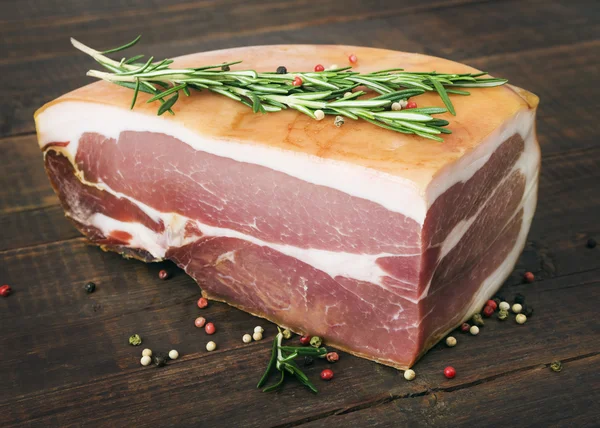 Prosciutto  with rosemary and pepper — Stock Photo, Image