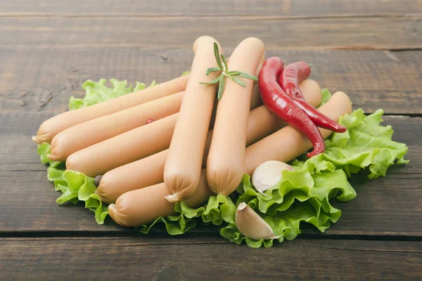 Sausages and fresh vegetables — Stock Photo, Image