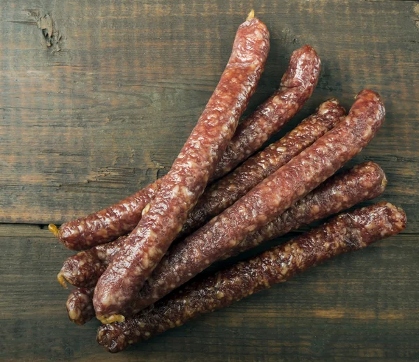 Dried sausages on table — Stock Photo, Image