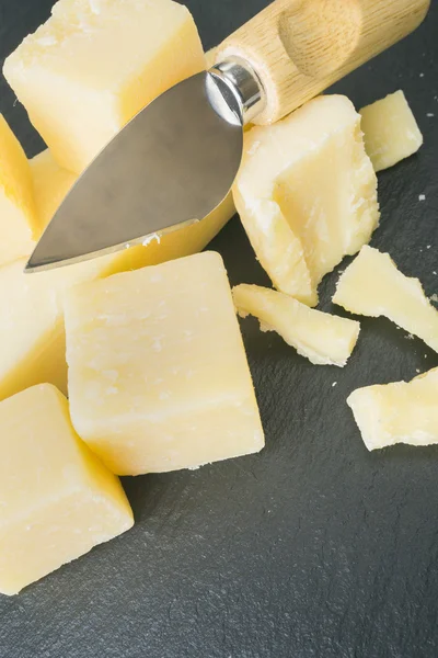 Parmesan cheese with knife — Stock Photo, Image