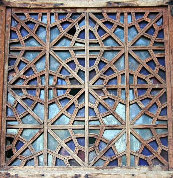 Decorative carved wooden lattice on the old window — Stock Photo, Image