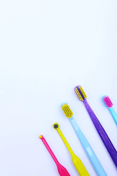 Assorted Toothbrushes Oral Hygiene Copy Space View Vertical Photo — Stock Photo, Image