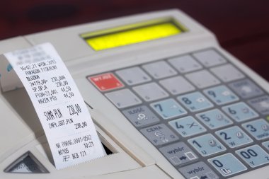 Cash register with cash register receipt clipart