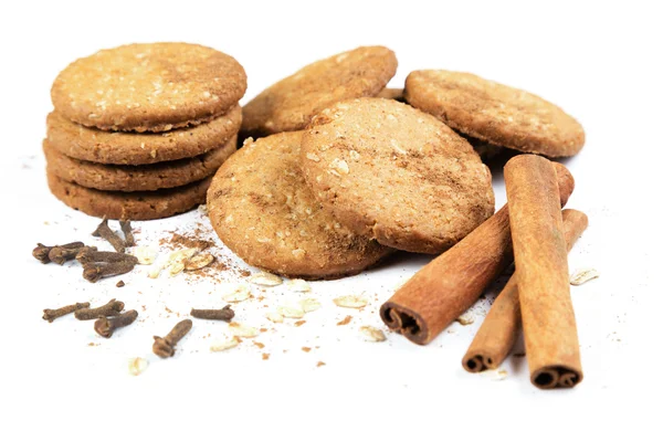 Cookies honey with nuts, cereals, cinnamon and cloves on a white background — Stock Photo, Image