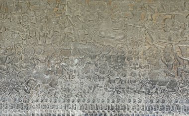 close-up texture of stone carving ancient bas-reliefs of the Temple of Angkor Wat in Cambodia clipart