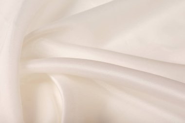 Saten kumaşın makro dokusu şampanya renkli stüdyo