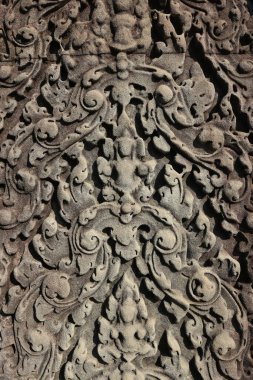 Kamboçya 'daki Angkor Wat Tapınağı' nın eski kaya oymacılarının yakın çekim dokusu.