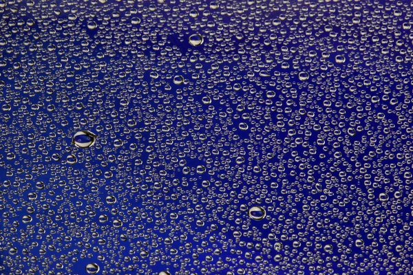 Close Textuur Waterdruppels Glas Blauwe Achtergrond — Stockfoto