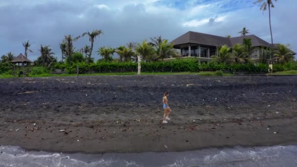 Woman Walk Deserted Beach Black Sand Lot Trash Wearing Masks — Stock Video