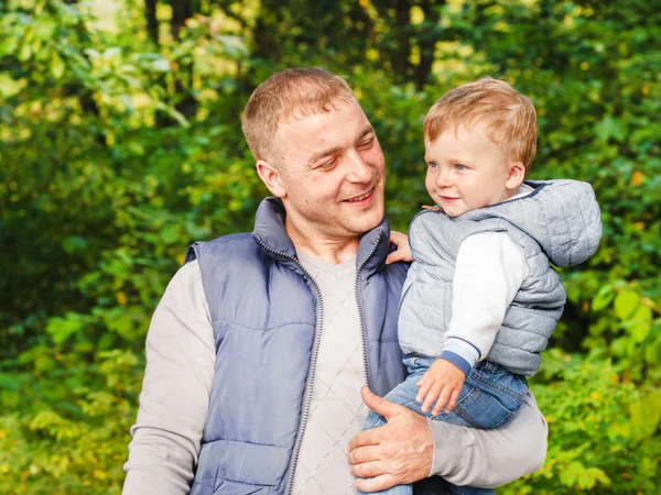 Father holding son on hands — Stock Photo, Image