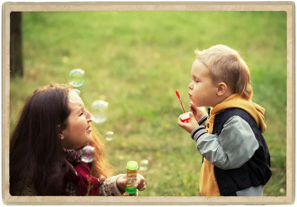 Mother with son in park nature — Stock Photo, Image