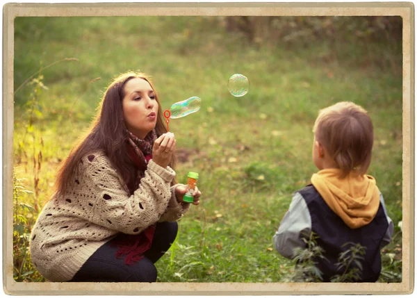 Family mother with son walking in park — Stock Photo, Image