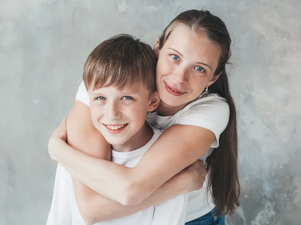 Family Mother Hugging Smiling Son — Stock Photo, Image