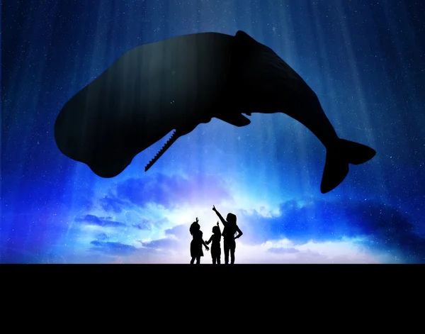 Дети с китом — стоковое фото